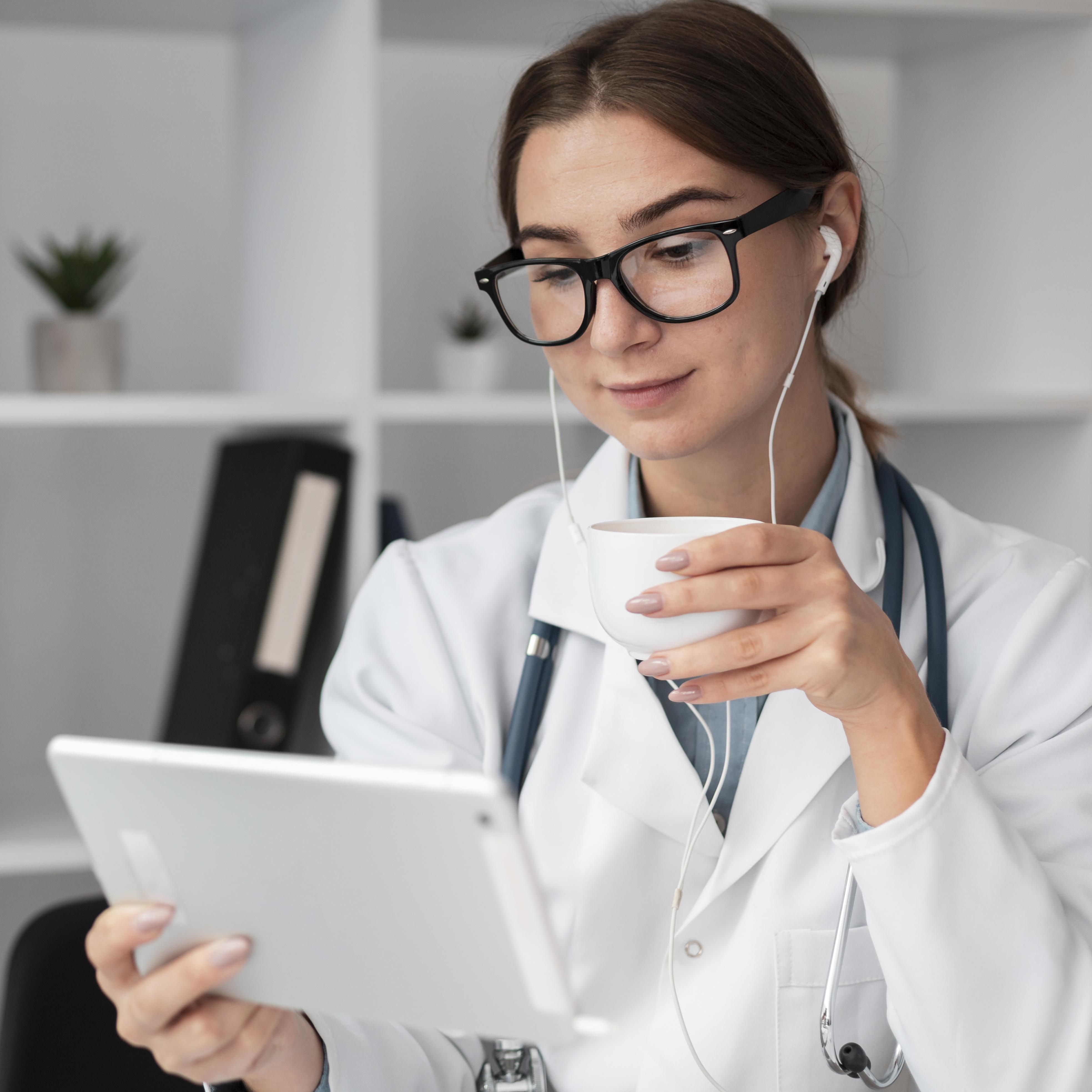 Person sitting on couch working on laptop